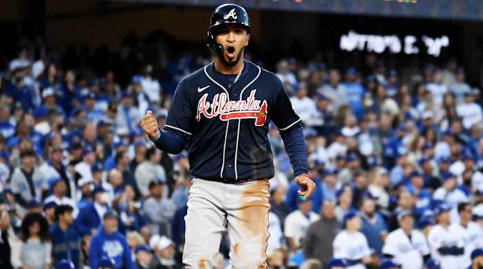 Oct 20, 2021; Los Angeles, California, USA; Atlanta Braves left fielder Eddie Rosario (8) celebrates scoring in the third inning a during game four of the 2021 NLCS at Dodger Stadium.